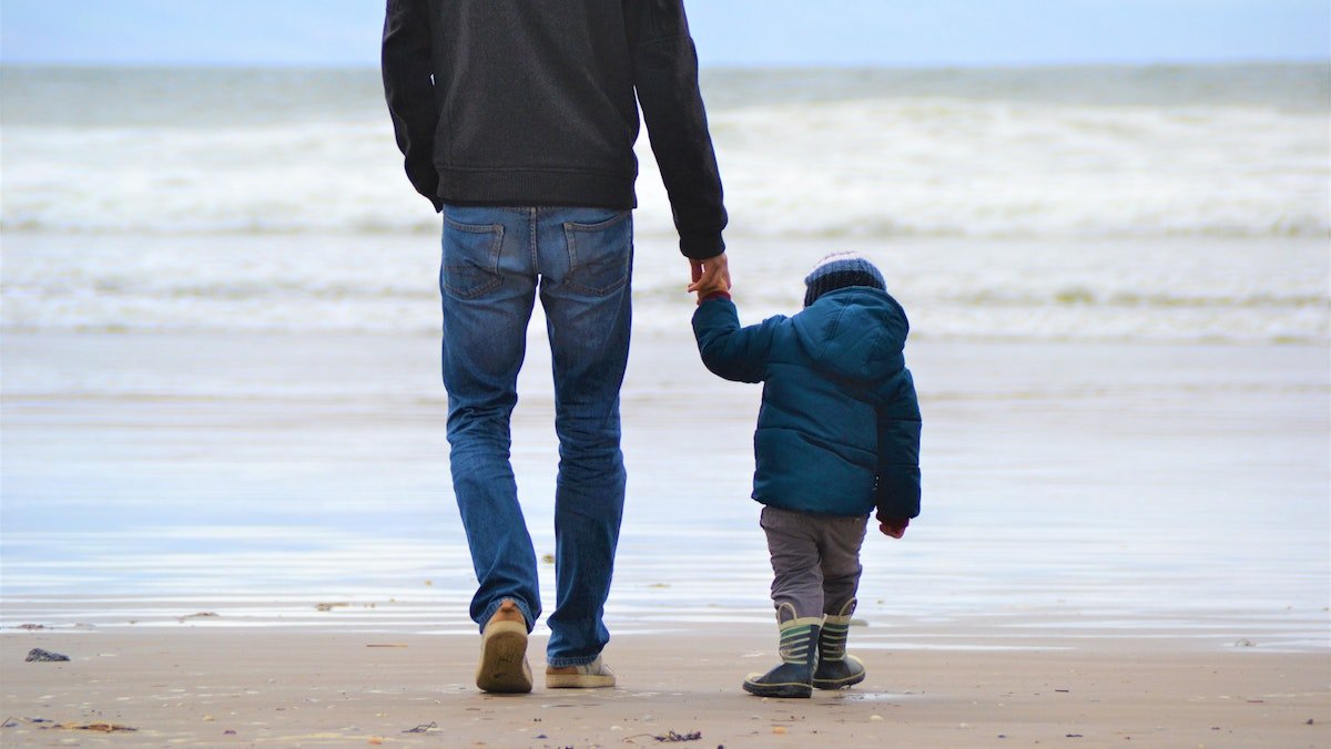 Dad with son on beach