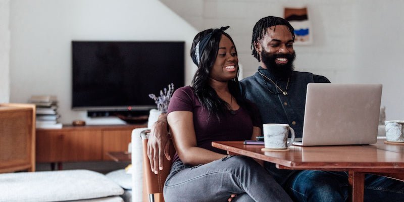 happy couple managing money together