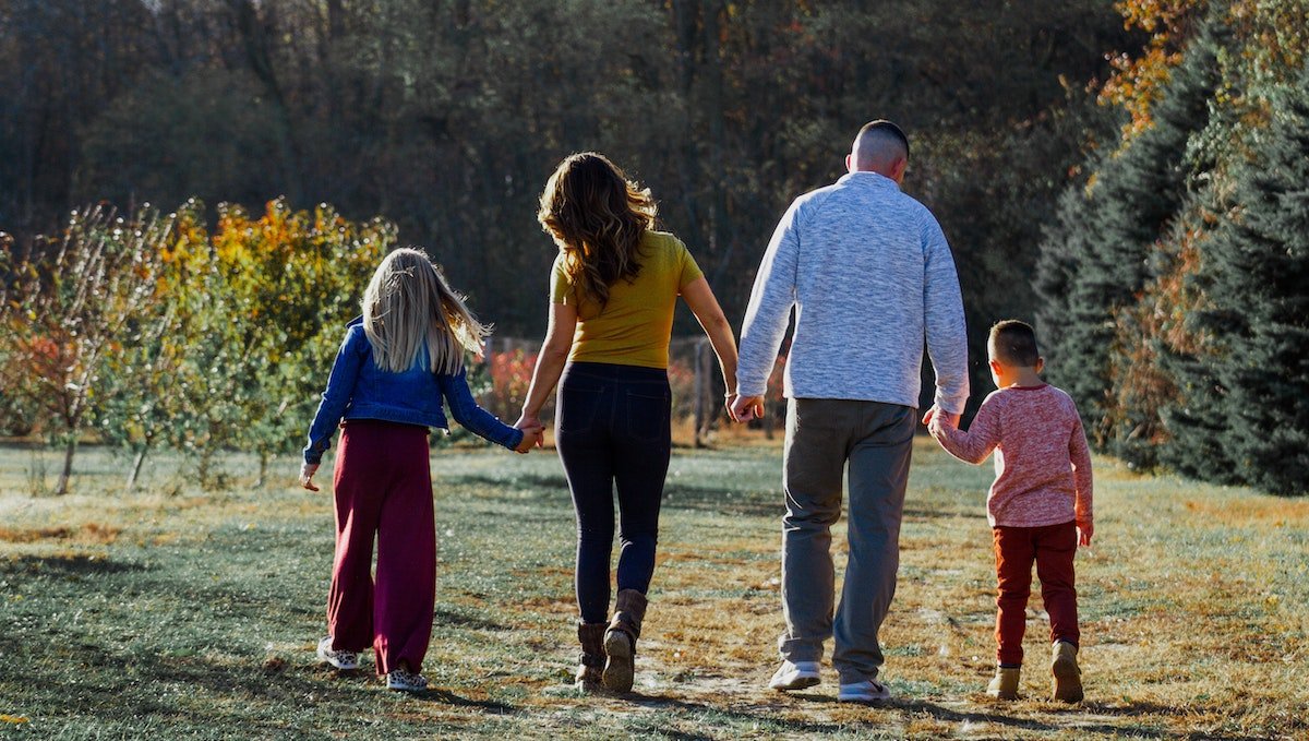 Family of Four Walking Together