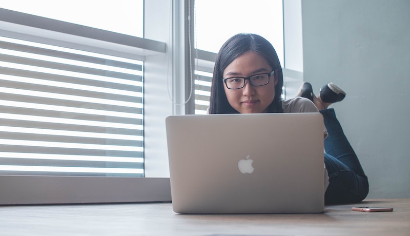 Woman looking at laptop