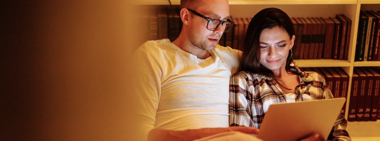 Couple looking at laptop