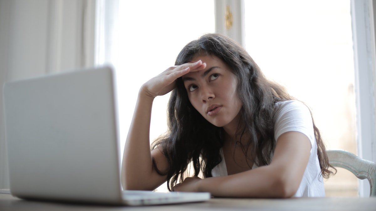 Woman confused by laptop