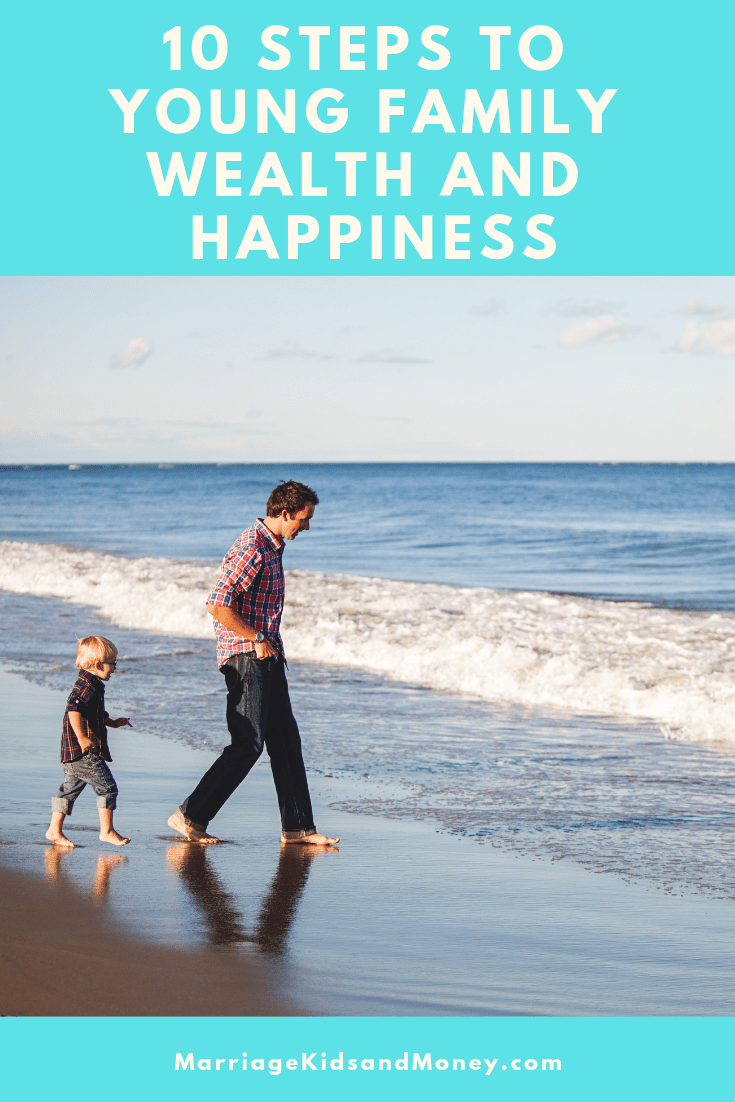 Father and son on the beach walking